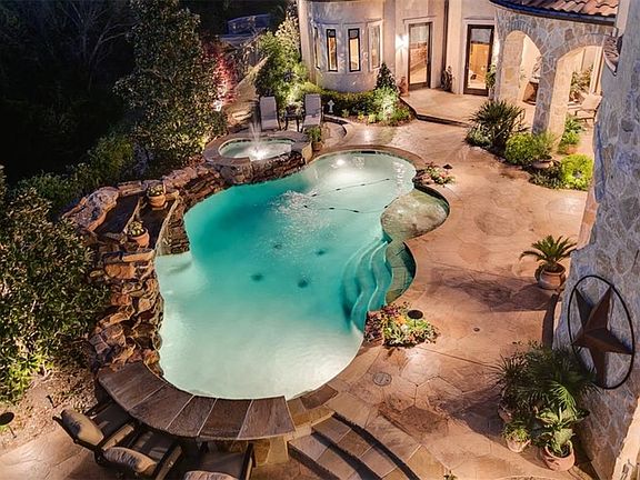 Night view of pool and back gardens.