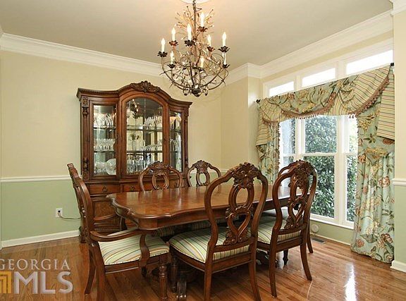 Large formal dining room with hardwood floors