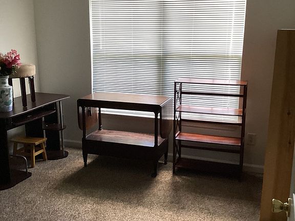 The second bedroom (furniture already moved) is larger than the picture