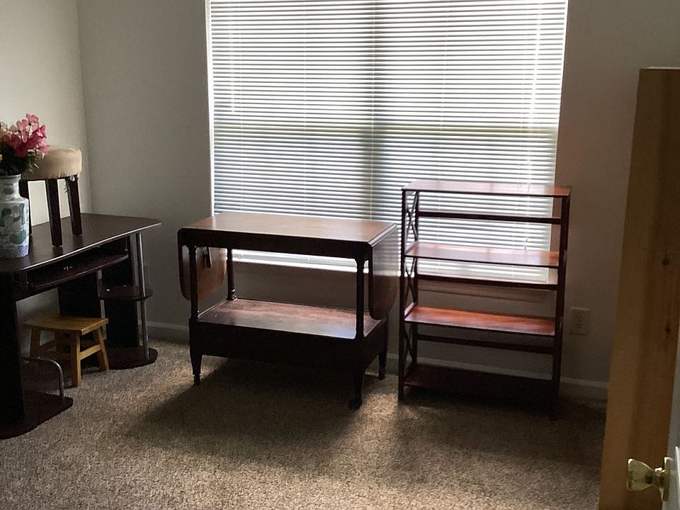 The second bedroom (furniture already moved) is larger than the picture