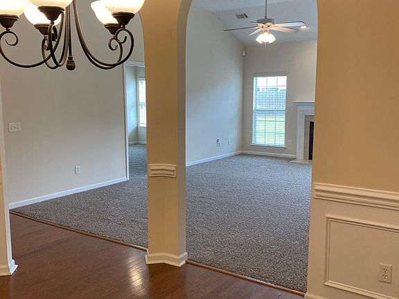 View from Dining Room through Archway to Living Room