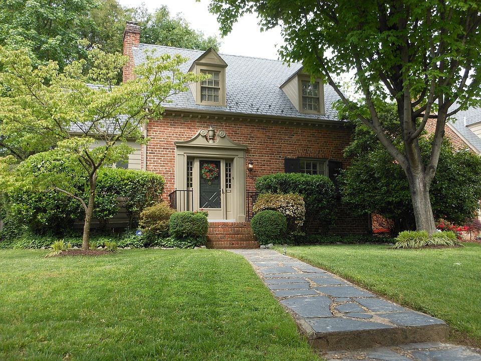 Landscaped Yard with brick stoop, slate roof and slate sidewalk