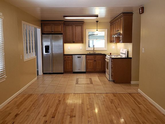 Gorgeous kitchen with granite counter tops and decorative tile flooring.