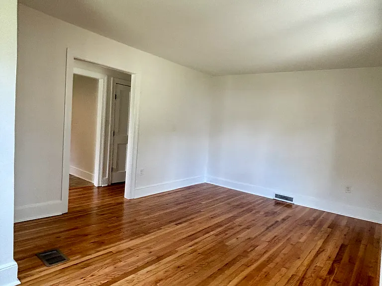 Living room with bright morning sun. Spacious (180 sq.ft) with 2 large windows.