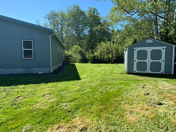 Large side yard and back yard. 10x 15 storage shed.