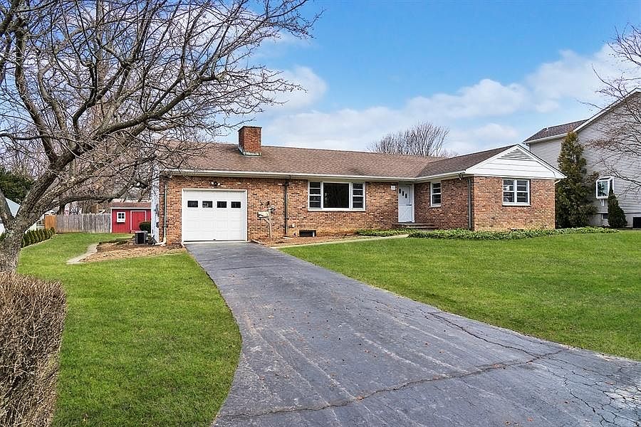 Home has been painted and landscaped since this photo was done. Updated picture is pending.