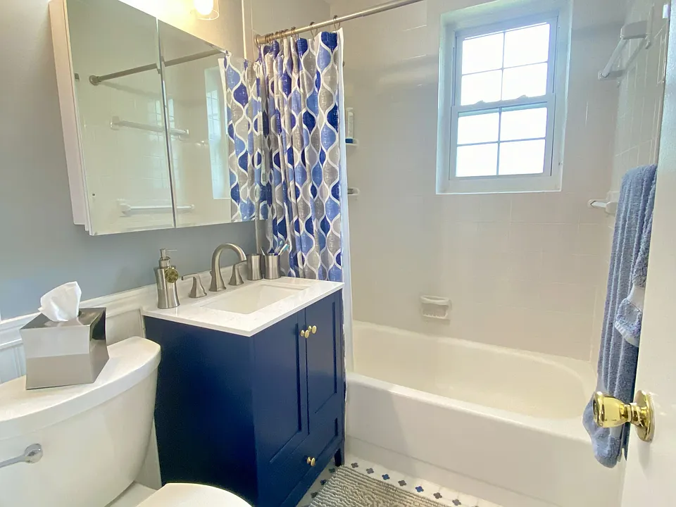 The floors, toilet, sink, vanity, mirror, and lights are all just a few years old. There is a brand new faucet on the sink now AND a bidet with heated seat, water, and fan.