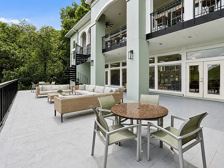 Experience luxury outdoor living with views of the Chattahoochee River and lush landscaping.
