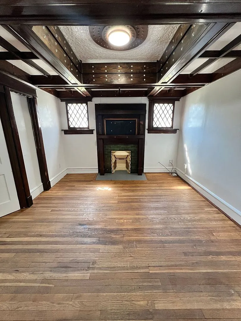 Stylish 2-Bedroom Unit Featuring Decorative Fireplace — Photo 3