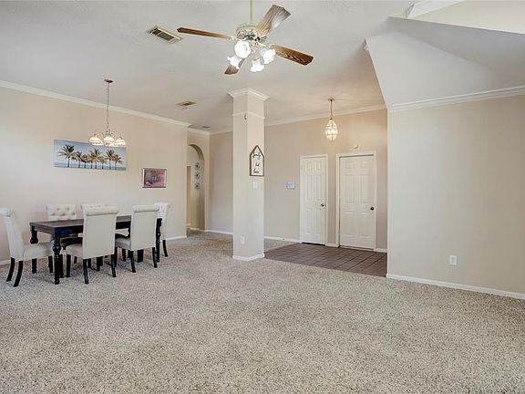 The connected living room and dining room creates a spacious area that can be used for many purposes.
