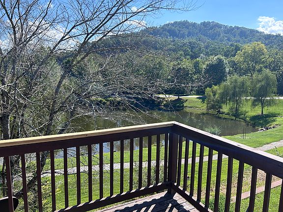 Deck view over common area, pond and walking trail