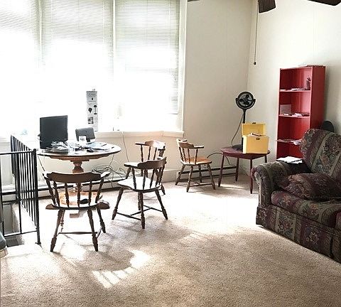 Huge living room with lots of natural light and 10' plus cei