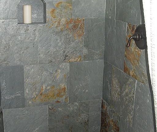 River rock flooring and custom-made slate tiles in master shower
