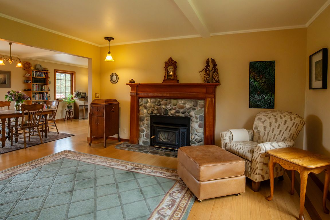 Main house Floor 1: Living room with wood fireplace