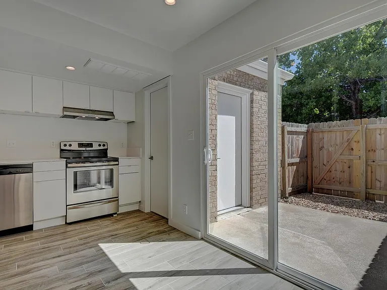 Back door connected to utility and laundry room which has a dead bolt so you can come and go from the front of the property or the back.