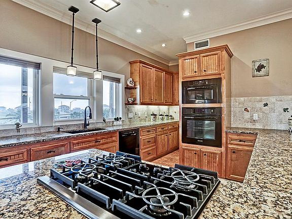 View towards the back of the kitchen - large pantry around corner.