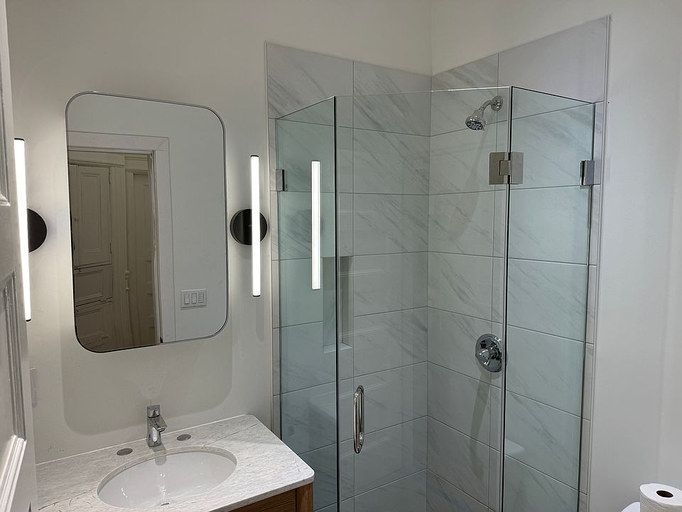 Brand new (Nov 2024) bathroom. Recessed lighting, custom finishes, glass shower door.