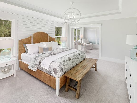 Elegant owner s suite with shiplap accent wall and tray ceiling. Bright and spacious with room to r