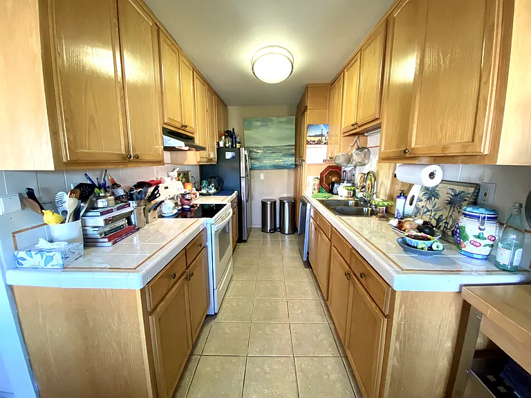 Fully Equipped Kitchen, with dishes, pots, pans, silverware, glasses, dishwasher and cookware....