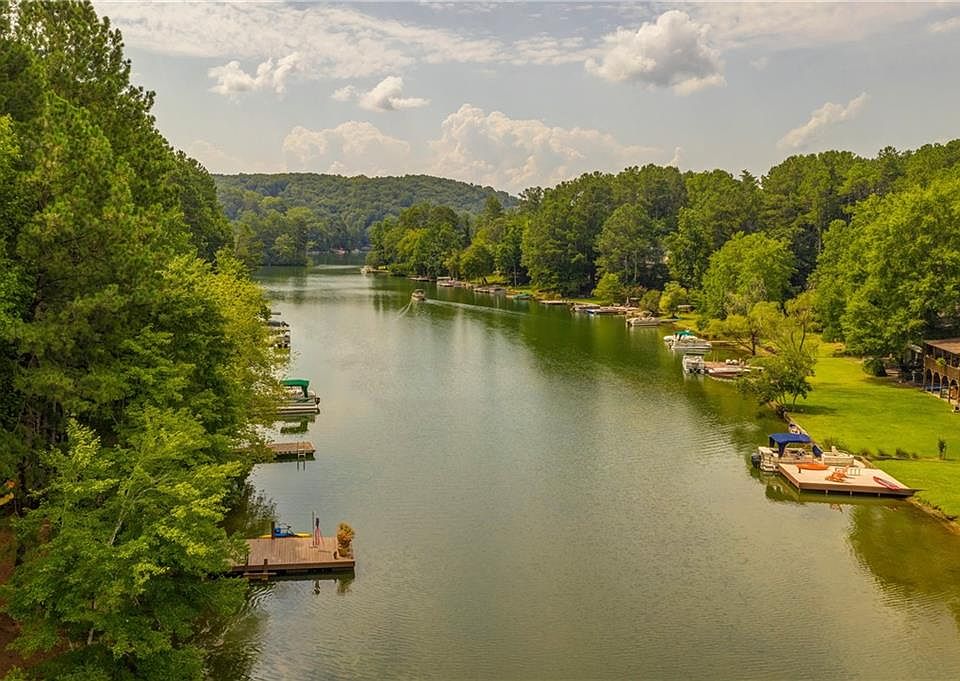 Image 1: Aerial View of Private Cove Above Dock