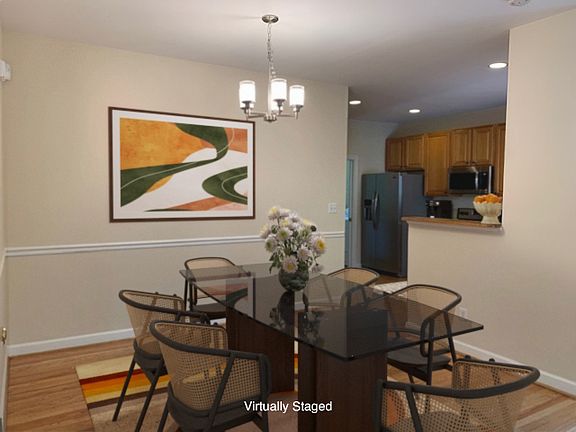 The dining area is versatile, accommodating tables of various sizes and styles.