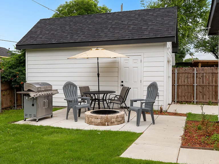 Patio featuring grill, fire pit and outside seating.