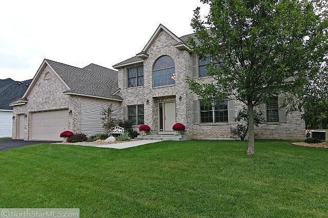 Brick exterior, oversized finished 3.5 stall garage with heated shop.