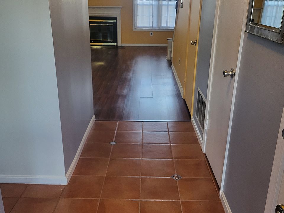 Front entry. Half bath is first door on right. Second door (on right) is coat closet. Third door (on right) is stairs to basement. Kitchen is on left.