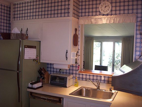 Kitchen (pass through window into Family room)