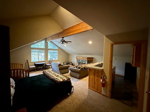 Huge game room with queen murphy bed, twin bed two couches, and wet bar Murphy bed and twin