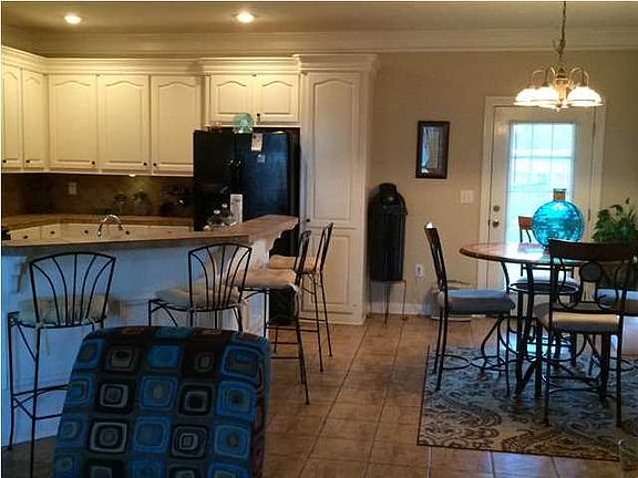 Nice large kitchen with tons of cabinets and large breakfast bar.