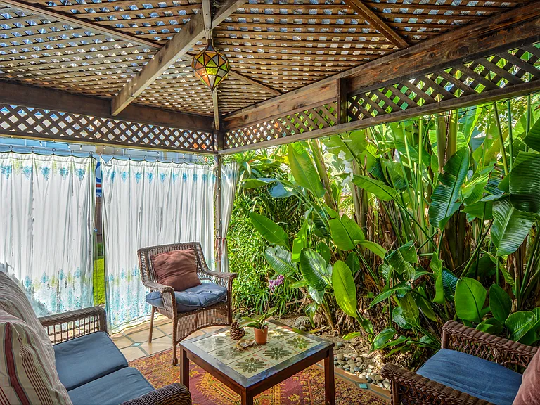 Tropical Cabana Room with surrounding curtains for added privacy.