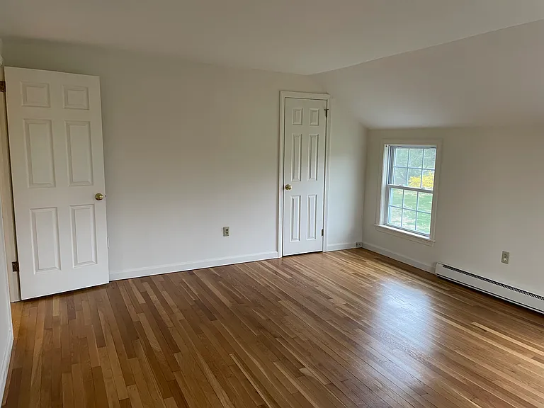 View to front of master bedroom from opposite end inside the room