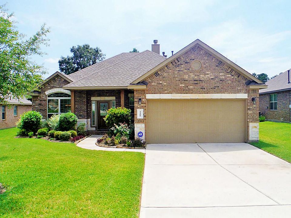 Exterior front: Fully bricked home with stone accents and great curb appeal.