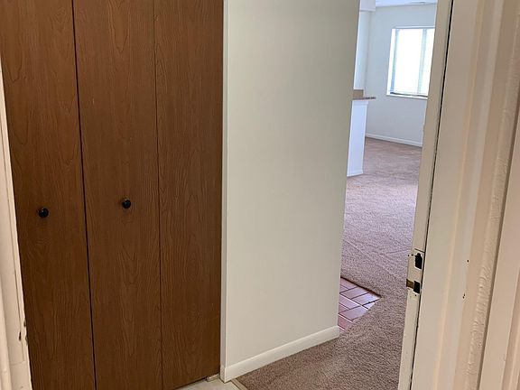 Walking in to 2196 H- entry closet as you open the front door from hallway