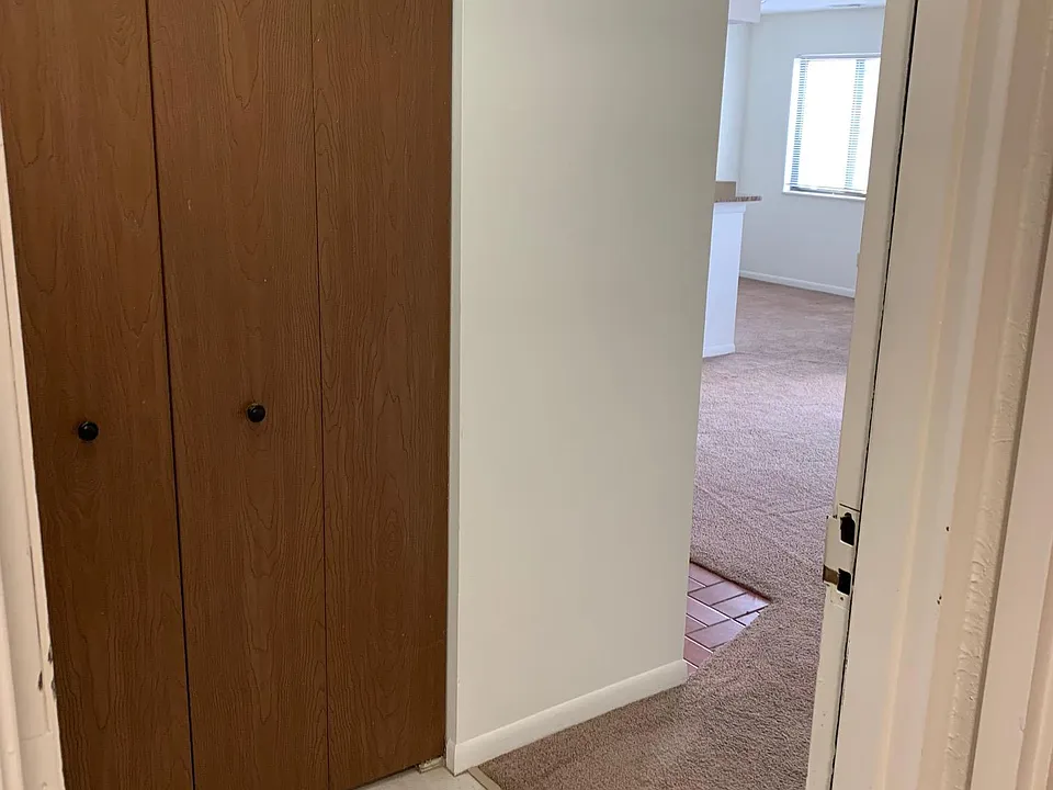 Walking in to 2196 H- entry closet as you open the front door from hallway