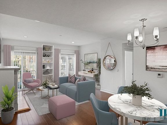 Dining and Living Room Space with Electric Fireplace, Vinyl Flooring, and Balcony