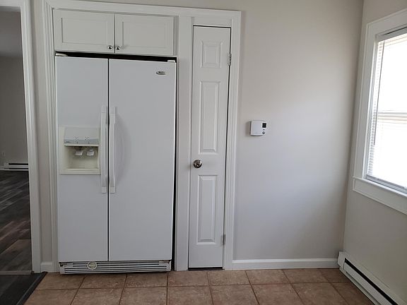 Recessed frig with icemaker. Broom closet. Programmable thermostat.