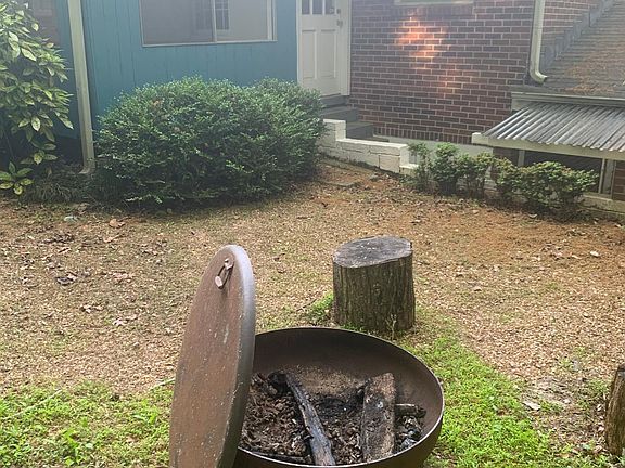 Plenty of free firewood for firepit - property is 1.4+ heavily-wooded acres across the two houses...