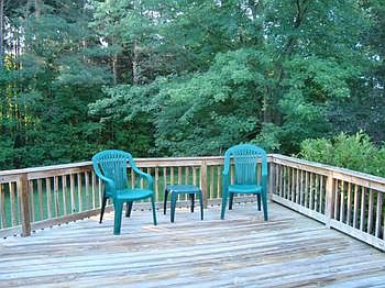 Summer picture of the deck off the dining area.