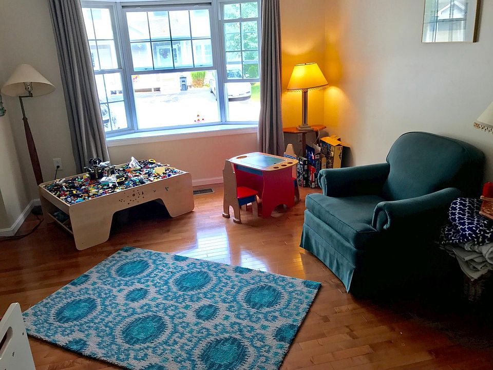 Living room with bay window and hardwood floors
