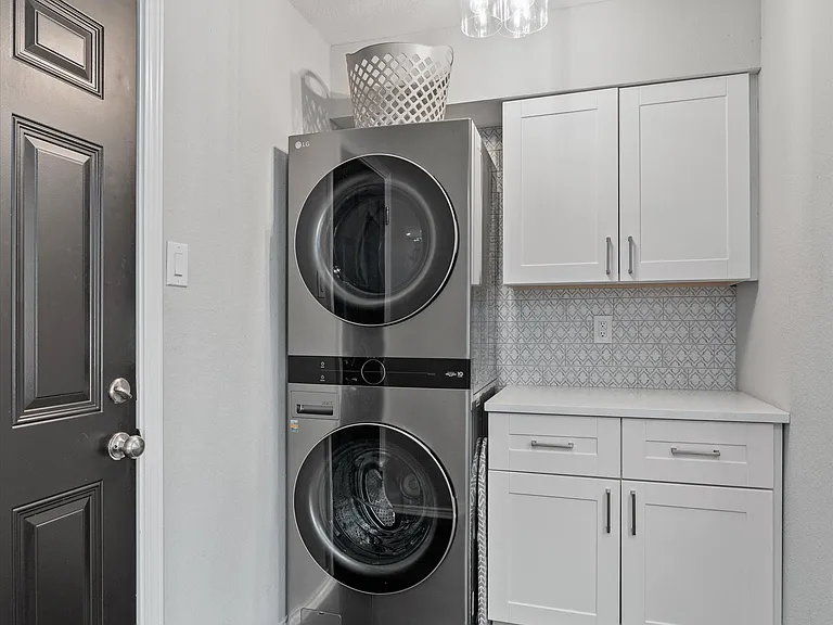 Separate Utility Room with Counter for folding, New Washer & Dryer and Extra Storage!