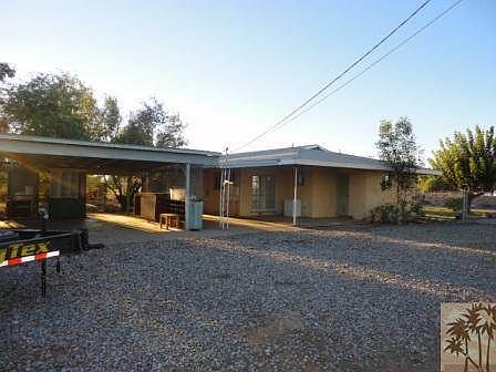 Rock drive and rear yard