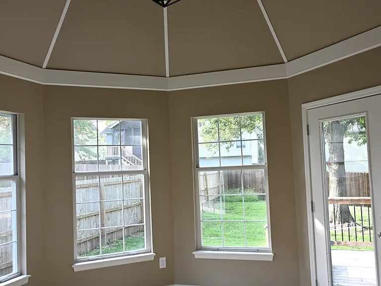Dining room with vaulted ceiling. View form kitchen.