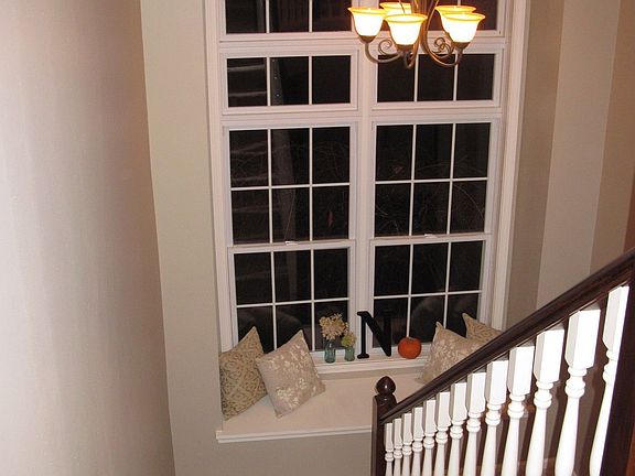 2 story foyer with beautiful windows and window seat