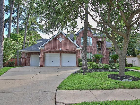 Double wide driveway and sidewalk. Side entry service door to backyard offers brick paver walkway.