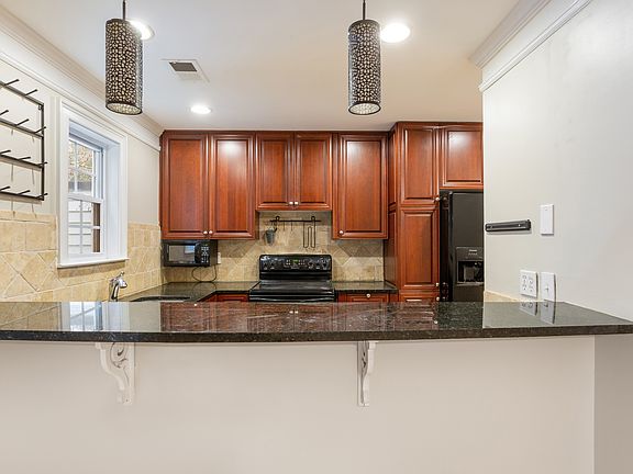 The Kitchen, built in bar.
