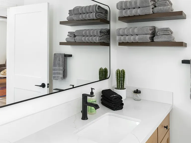 Full size bathroom with towels, and initial shampoo, conditioner, and body wash provided.