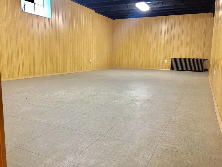 spacious entertainment room in the basement