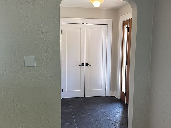 Entryway with spacious coat closet.